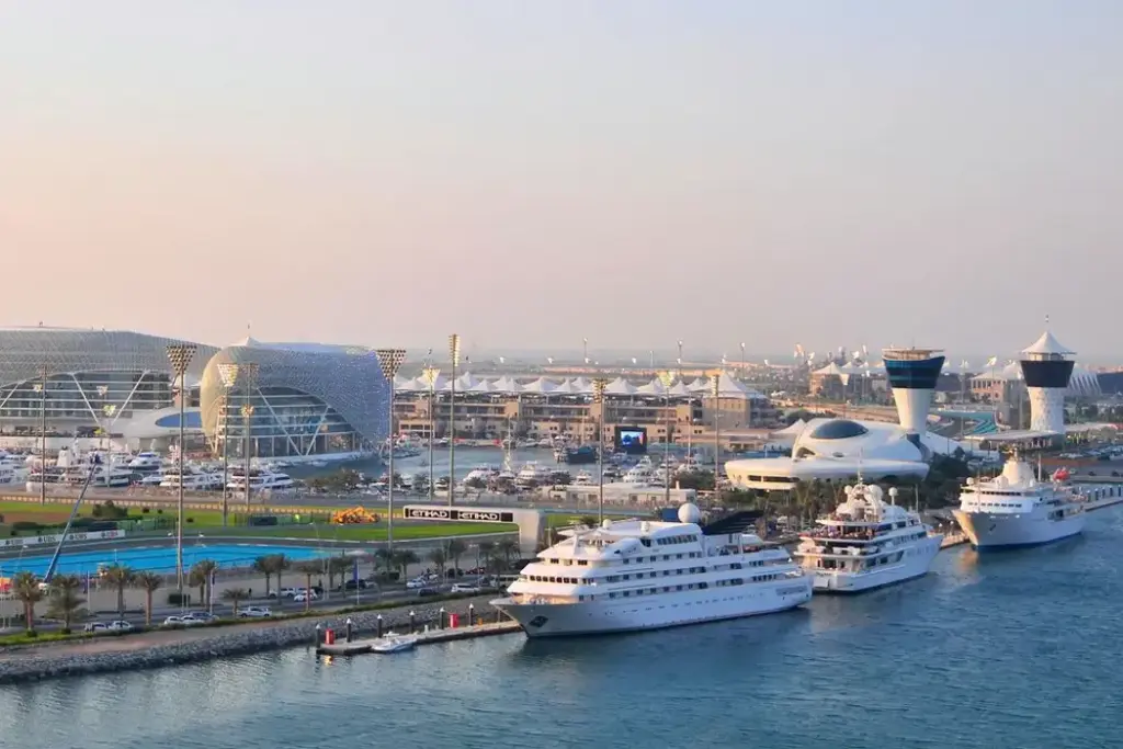 Aerial view of superyachts docked at Yas Marina near the Yas Viceroy hotel and Formula 1 circuit in Abu Dhabi.
