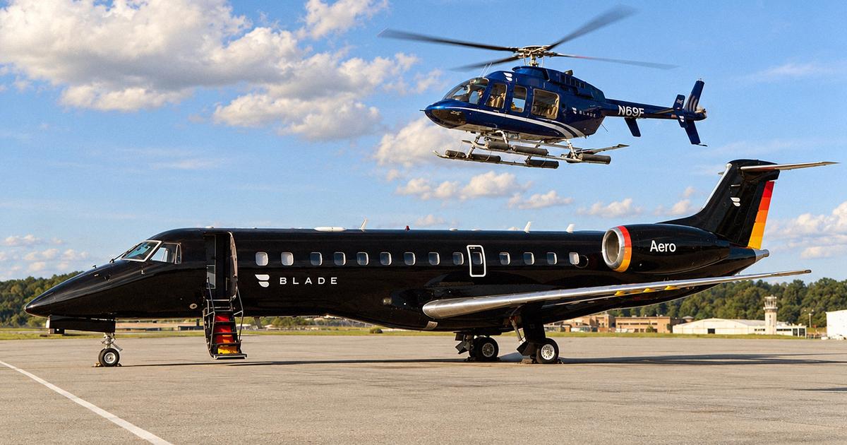 A black private jet marked BLADE and Aero sits on a tarmac as a blue BLADE helicopter flies above it.