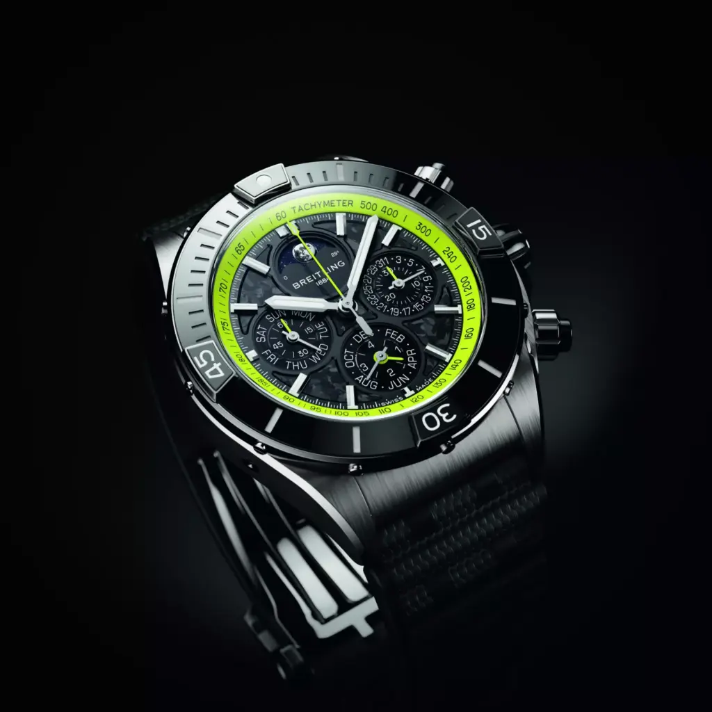 Close-up of a Breitling Super Chronomat watch with a lime green bezel, multiple subdials, and a black strap.