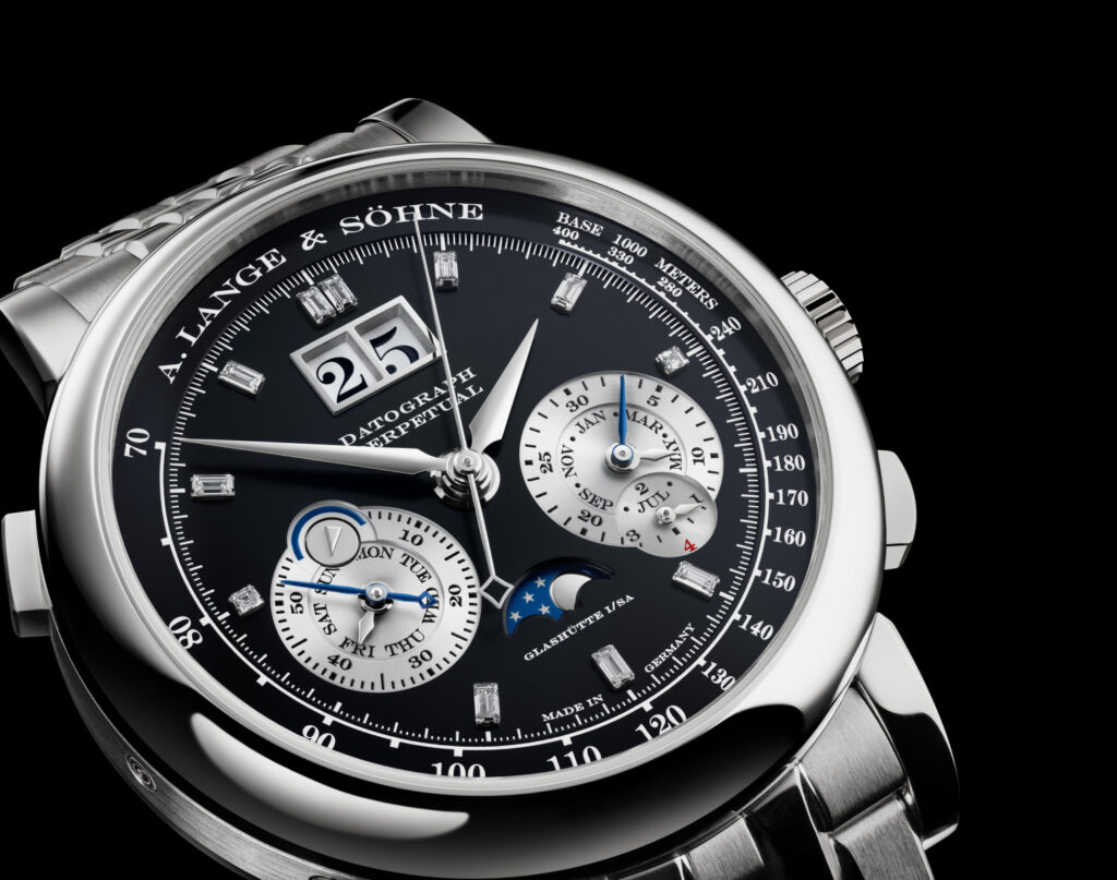 Close-up of an A. Lange & Söhne Datograph Perpetual watch dial with diamonds, moonphase, and calendar subdials.
