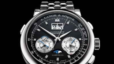 Close-up of an A. Lange & Söhne Datograph Perpetual watch with black dial, moonphase, and steel bracelet.